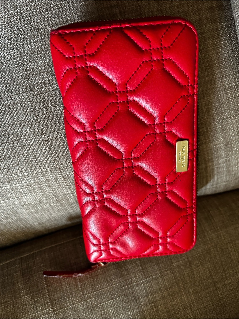 kate spade Red Quilted Zip-Around Wallet with Gold Plaque